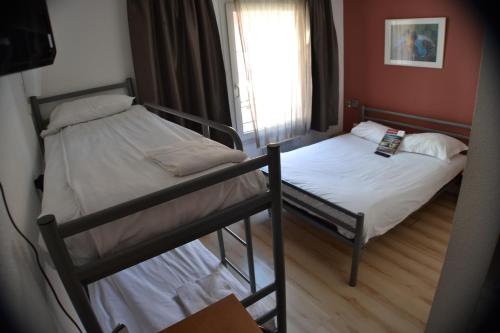 Habitación Cuádruple con 1 cama doble y 2 literas del hotel Primo Colmar Centre