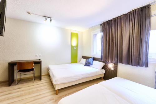 Habitación Cuádruple - 4 camas individuales del hotel Primo Colmar Centre. Foto 1