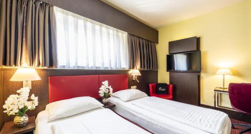 Habitación Doble Estándar - 2 camas del hotel PLAZA Premium Salzburg. Foto 5