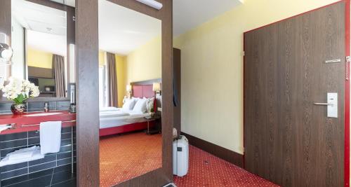 Habitación Doble Confort del hotel PLAZA Premium Salzburg. Foto 2