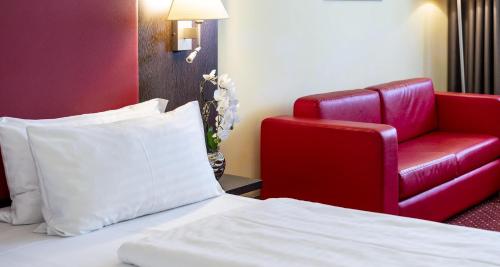 Habitación Triple Confort del hotel PLAZA Premium Salzburg. Foto 5