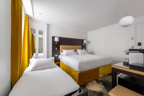Habitación Triple con bañera del hotel 15 Montparnasse. Foto 5