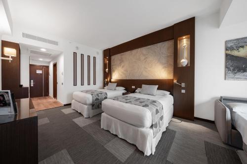 Habitación Familiar Deluxe - 2 camas individuales del hotel Riu Plaza Panamá. Foto 3