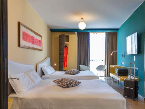 Suite Deluxe con 2 camas dobles del hotel Ibis Styles Catania Acireale. Foto 2