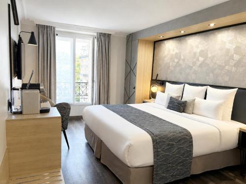 Habitación Deluxe con cama extragrande del hotel Best Western Opera Batignolles. Foto 2