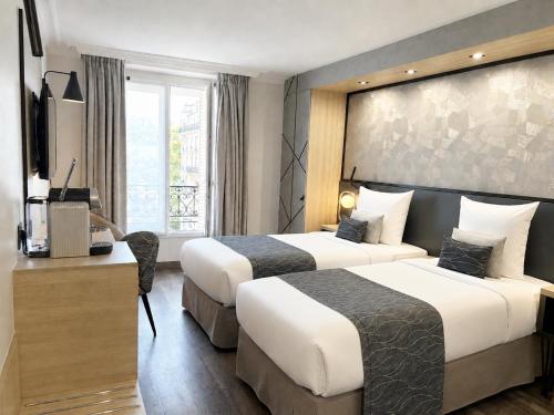 Habitación Deluxe con cama extragrande del hotel Best Western Opera Batignolles. Foto 4