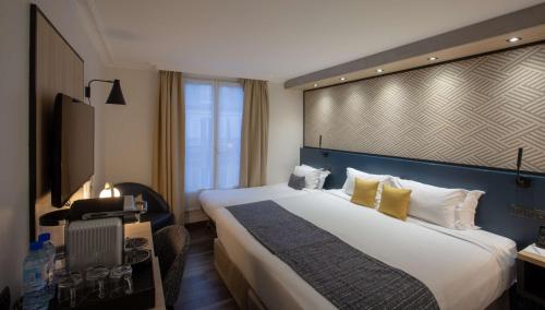 Habitación Triple Deluxe con 1 cama extragrande y 1 cama individual - No fumadores del hotel Best Western Opera Batignolles