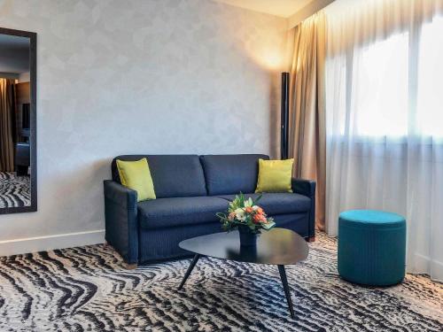 Habitación Executive con cama grande y sofá de 2 plazas - Vistas a París del hotel Novotel Paris 14 Porte d'Orléans. Foto 4