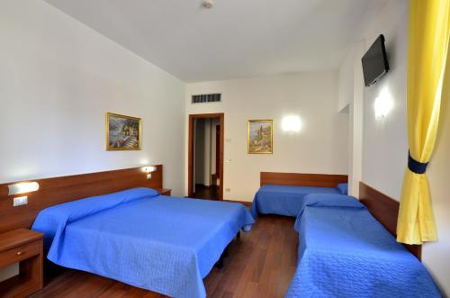 Habitación Cuádruple Clásica del hotel Tex. Foto 1