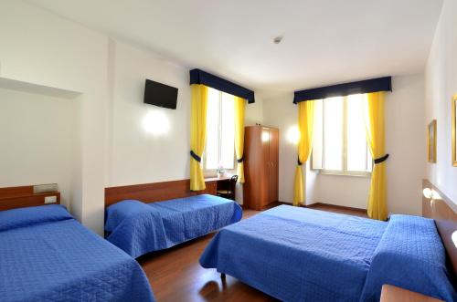 Habitación Cuádruple Clásica del hotel Tex. Foto 2