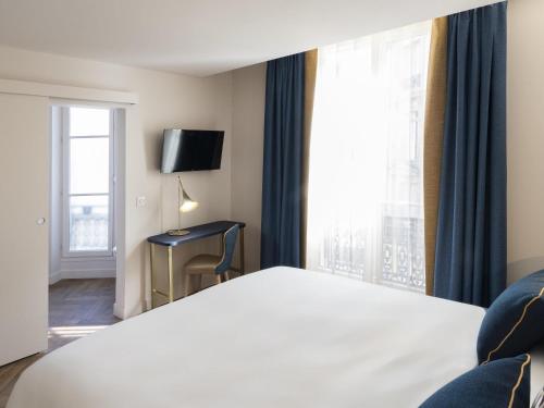 Habitación Superior - 1 cama grande del hotel Hôtel Mercure Paris Opéra Lafayette. Foto 3