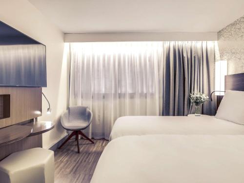 Habitación Doble Superior - 2 camas del hotel Mercure Paris Arc De Triomphe Etoile. Foto 4