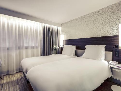 Habitación Doble Superior - 2 camas del hotel Mercure Paris Arc De Triomphe Etoile. Foto 5