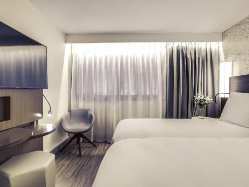 Habitación Doble Superior - 2 camas del hotel Mercure Paris Arc De Triomphe Etoile. Foto 6