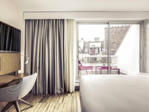 Habitación Clásica con cama individual del hotel Mercure Paris Arc De Triomphe Etoile. Foto 9