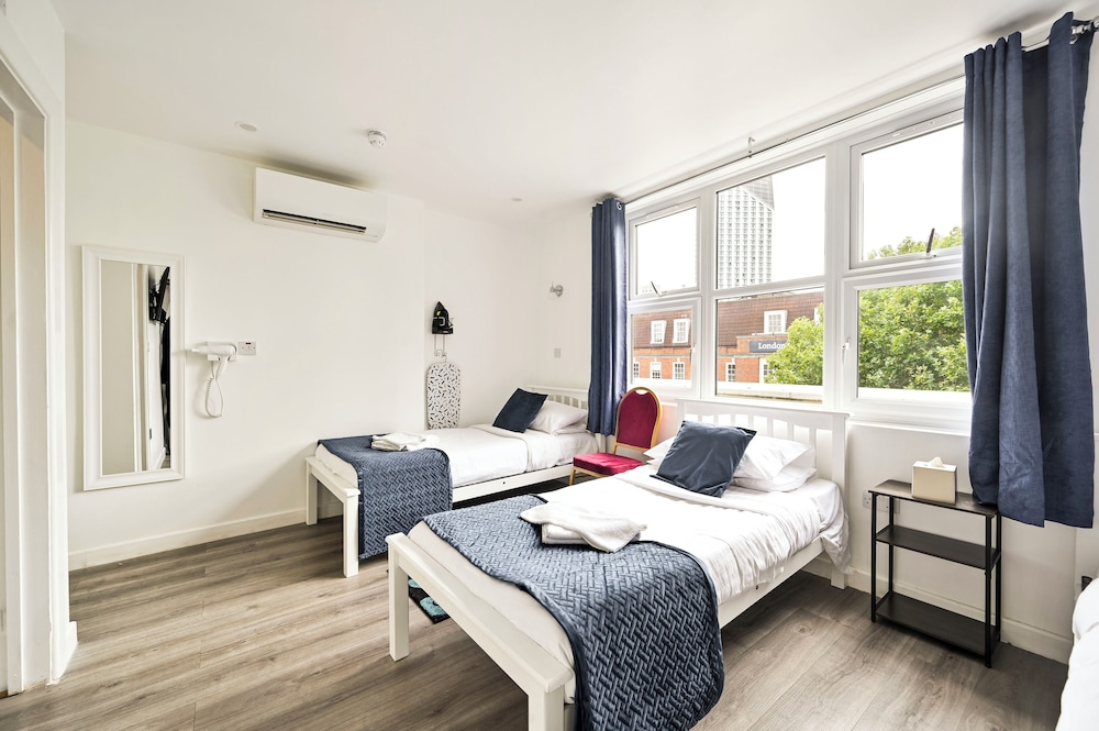 Habitación triple estándar, 3 camas individuales del hotel City London. Foto 6