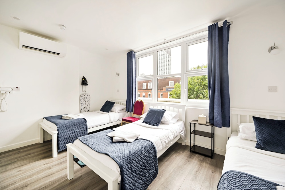 Habitación triple estándar, 3 camas individuales del hotel City London. Foto 7