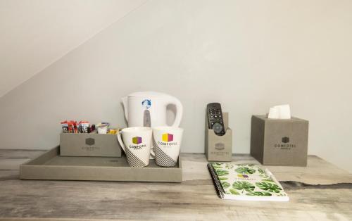 Habitación Triple del hotel Comfotel Grn. Foto 3