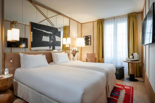 Habitación Doble Deluxe - 2 camas del hotel Le Belgrand Hotel Paris Champs Elysees, Tapestry Collection by Hilton. Foto 4