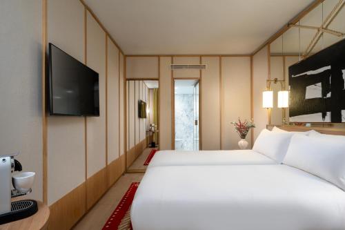 Habitación Doble Deluxe - 2 camas del hotel Le Belgrand Hotel Paris Champs Elysees, Tapestry Collection by Hilton. Foto 5