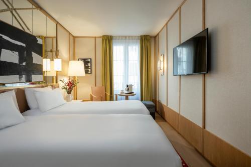 Habitación Doble Deluxe - 2 camas del hotel Le Belgrand Hotel Paris Champs Elysees, Tapestry Collection by Hilton. Foto 7