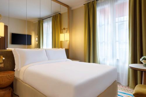 Habitación Doble del hotel Le Belgrand Hotel Paris Champs Elysees, Tapestry Collection by Hilton. Foto 2