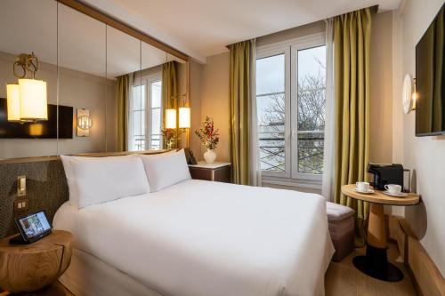 Habitación Doble del hotel Le Belgrand Hotel Paris Champs Elysees, Tapestry Collection by Hilton. Foto 6
