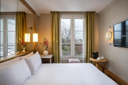 Habitación Doble del hotel Le Belgrand Hotel Paris Champs Elysees, Tapestry Collection by Hilton. Foto 7