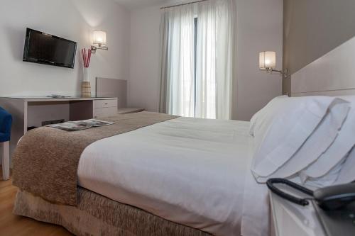 Habitación Doble con balcón - 1 o 2 camas del hotel Aacr Museo. Foto 1