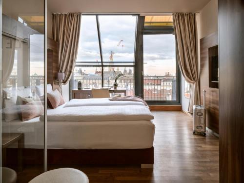 Habitación Doble Signature con vistas a la ciudad del hotel Flemings Selection Wien-City. Foto 1