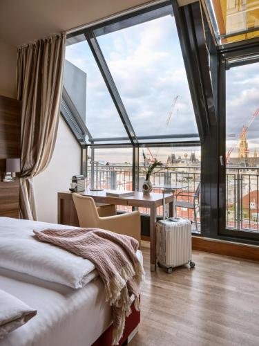 Habitación Doble Signature con vistas a la ciudad del hotel Flemings Selection Wien-City. Foto 6