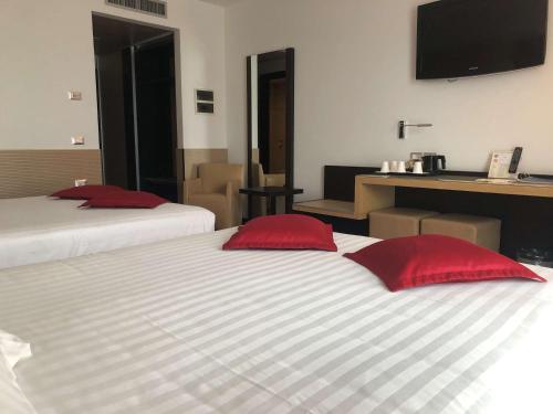 Habitación Cuádruple Confort - 2 camas grandes del hotel Best Western Plus Galileo Padova. Foto 10