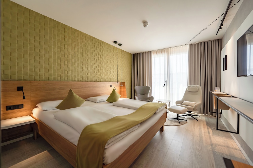 Habitación ejecutiva con 1 cama queen - size del hotel Novotel Karlsruhe City. Foto 1