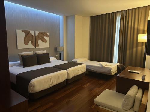 Habitación Triple del hotel Carrís Cardenal Quevedo