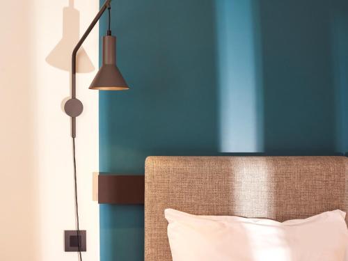 Habitación Doble con cama supletoria del hotel Ibis Madrid Aeropuerto Barajas. Foto 14