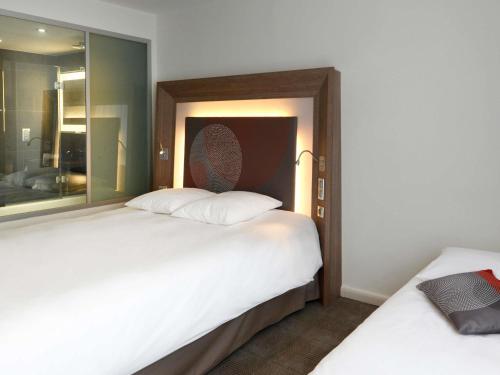 Habitación Clásica con 2 camas individuales (90 x 200 cm) y bañera del hotel Novotel Avignon Centre. Foto 1