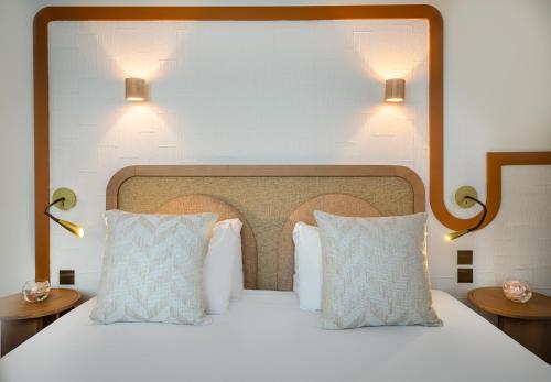Habitación Triple Deluxe del hotel Le Monna Lisa by Inwood Hotels. Foto 1