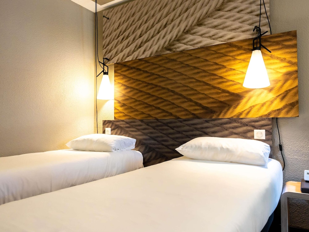 Habitación Standard con dos camas individuales del hotel Ibis Carcassonne Est La Cité. Foto 4