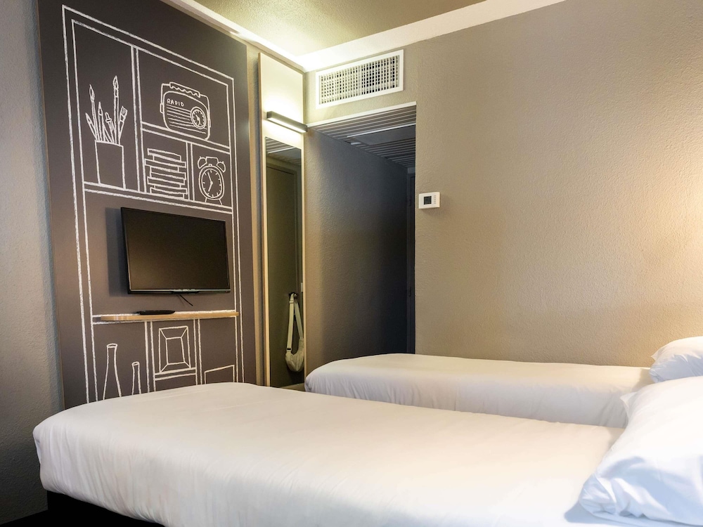 Habitación Standard con dos camas individuales del hotel Ibis Carcassonne Est La Cité. Foto 5