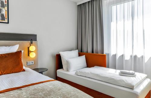 Habitación Triple Superior del hotel Leonardo Hannover Medical Park. Foto 4