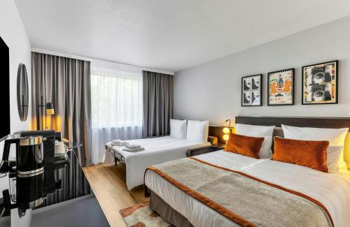 Habitación Cuádruple Familiar del hotel Leonardo Hannover Medical Park. Foto 1