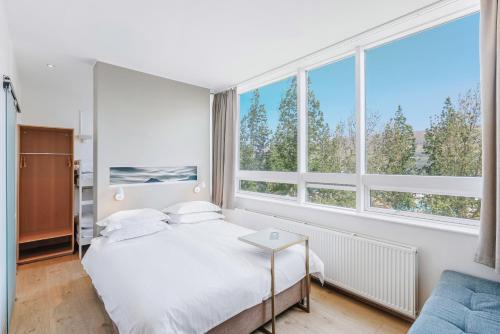Habitación familiar Vista Montaña 2 Camas individuales 1 Cama doble del hotel Akureyri - Berjaya Iceland Hotels