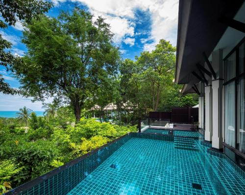 Villa Wellbeing Sanctuary con piscina y vistas parciales al océano del hotel Banyan Tree Samui. Foto 1