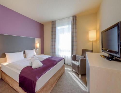 Suite Junior con cama grande del hotel Mercure Berlin City West