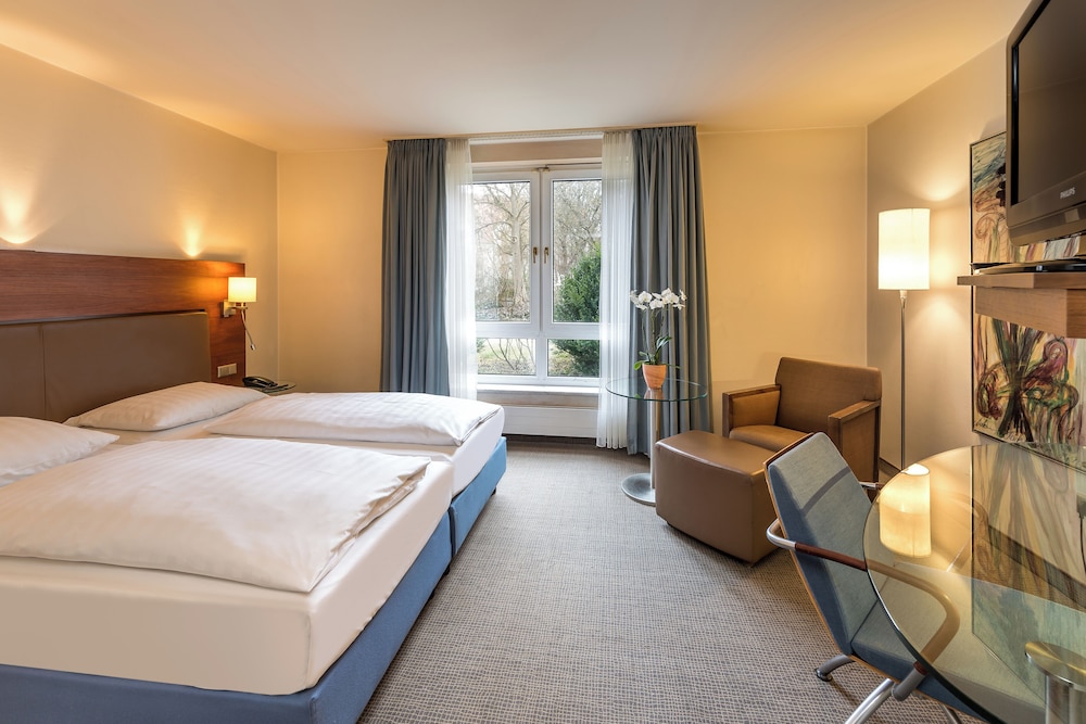 Habitación Privilege con una cama doble del hotel Sunday München Airport Freising. Foto 1