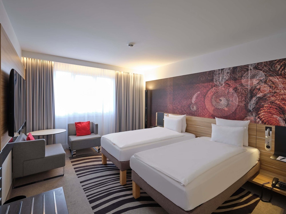 Habitación estándar con 2 camas individuales del hotel Novotel Munich City. Foto 5