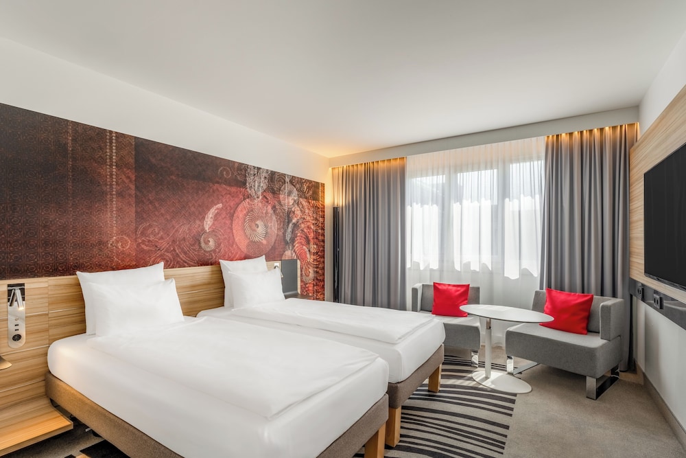 Habitación estándar con 2 camas individuales del hotel Novotel Munich City. Foto 1
