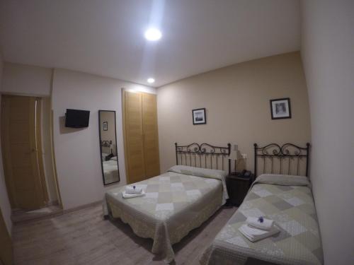 Habitación Triple del hotel El Pilar. Foto 16