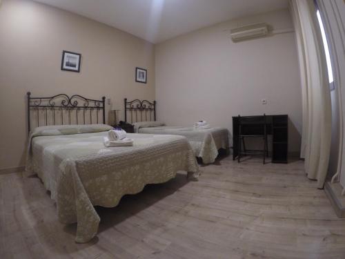 Habitación Triple del hotel El Pilar. Foto 21