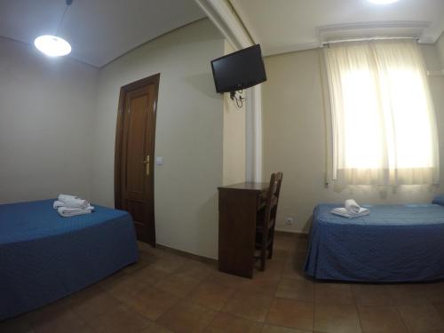 Habitación Triple del hotel El Pilar. Foto 23